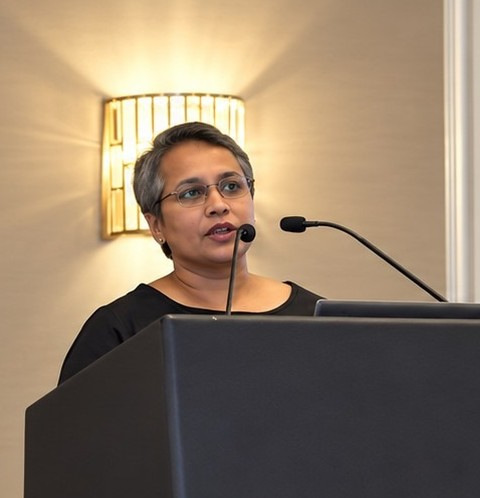Conference speaker at the lectern