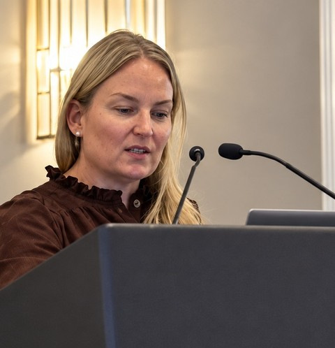Professor Katherine Grantz speaking at the lectern